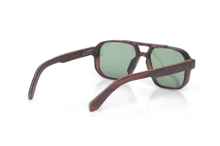 Wood eyewear of Rosewood CLAY. The wooden sunglasses CLAY combine a navigator-inspired design with bold lines and a tortoiseshell-finish front, delivering a warm look full of personality. Their rosewood temples stand out for their pronounced grain and deep tone, giving the whole frame an elegant, handcrafted character. The structure feels solid yet comfortable, thanks to the lightweight design and the curve of the temples, which helps maintain a stable fit for everyday wear. A modern, timeless model designed for daily use, with full UV protection.

Dimensions: 147x48 mm
Caliber: 54
 for Wholesale & Retail | Root Sunglasses® 