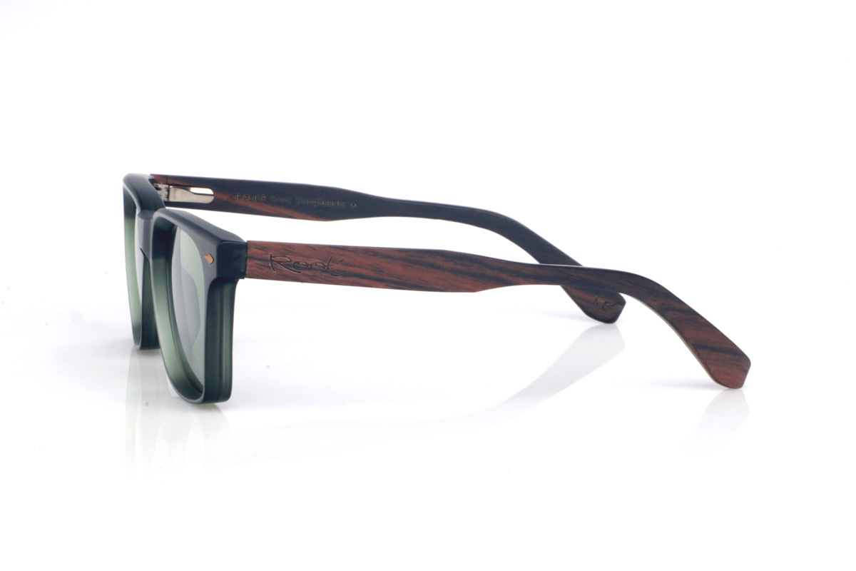 Wood eyewear of Ebony ROWAN. The ROWAN wooden sunglasses combine a modern, square silhouette with a dark translucent green front, creating a clean, contemporary look that’s easy to wear. Their ebony temples add an elegant handcrafted touch, with a subtle grain and a natural finish that balances the overall design. The frame offers a comfortable everyday fit thanks to its lightweight feel and the curvature of the temples, which helps keep a stable hold. A versatile, timeless model designed to go with you every day, with full protection against UV rays.

Dimensions: 145x47 mm
Lens width: 52
 for Wholesale & Retail | Root Sunglasses® 