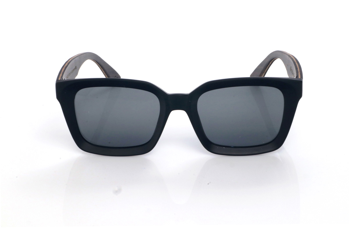 Wood eyewear of Oak ASH 2. The ASH 2 wooden sunglasses feature a clean black front and a bold look you notice as soon as you put them on, with a soft square shape that’s both sleek and powerful.
The contrast comes from the oak temples, which add warmth and an organic touch. The wood looks and feels premium: natural grain, a defined profile, and a curve that helps them sit securely, giving a stable feel. Full UV protection.

Measurements: 148x50
Caliber: 51
 for Wholesale & Retail | Root Sunglasses® 