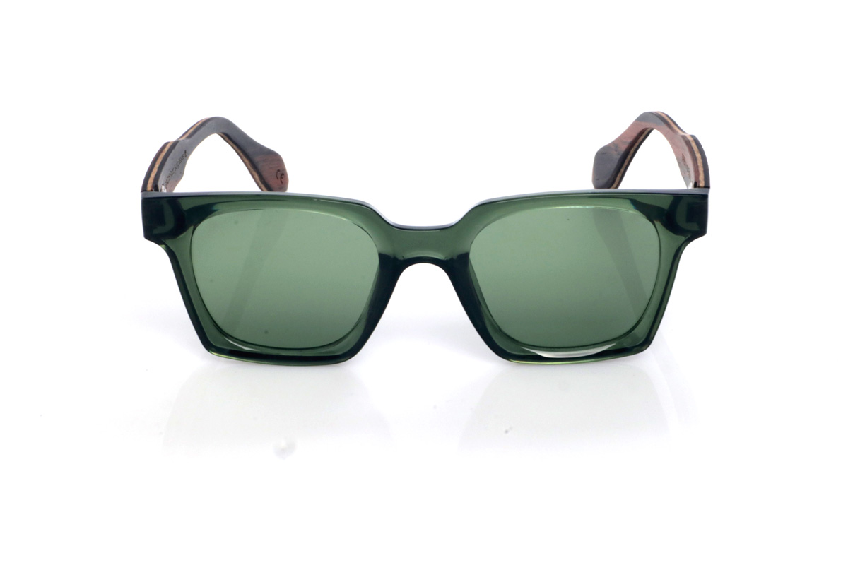 Wood eyewear of Ebony SEREN. The SEREN wooden sunglasses stand out with a translucent deep-green front, a glossy finish, and a rectangular shape with softly rounded corners that feels well-balanced and easy to wear. The chosen lens colours enhance a natural, laid-back look with a distinctly Mediterranean touch, ideal to pair with anything without losing personality.

Ebony temples add an elegant contrast with dark natural wood, featuring subtle grain that gives each piece its own unique nuances. A comfortable and stable model for everyday wear, with full UV protection.

Dimensions: 140x46 mm
Lens width: 48
 for Wholesale & Retail | Root Sunglasses® 