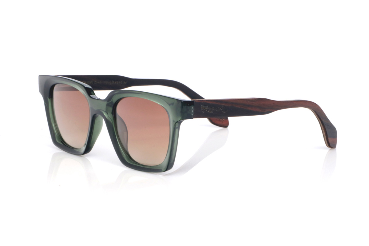 Wood eyewear of Ebony SEREN. The SEREN wooden sunglasses stand out with a translucent deep-green front, a glossy finish, and a rectangular shape with softly rounded corners that feels well-balanced and easy to wear. The chosen lens colours enhance a natural, laid-back look with a distinctly Mediterranean touch, ideal to pair with anything without losing personality.

Ebony temples add an elegant contrast with dark natural wood, featuring subtle grain that gives each piece its own unique nuances. A comfortable and stable model for everyday wear, with full UV protection.

Dimensions: 140x46 mm
Lens width: 48
 for Wholesale & Retail | Root Sunglasses® 