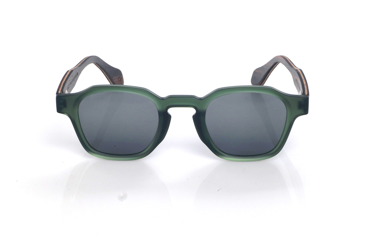 Wood eyewear of Ebony JADE. The JADE wooden sunglasses combine a translucent deep-green front with a smooth satin finish and a rounded-oval silhouette with soft lines that feels balanced and easy to wear. The keyhole bridge adds a classic touch with personality, keeping the overall look clean and very contemporary.

Ebony temples add the elegant contrast of dark natural wood, with subtle grain that gives each pair its own unique nuances. A comfortable and versatile model for everyday wear, with full UV protection.

Dimensions: 144x46 mm
Lens width: 46
 for Wholesale & Retail | Root Sunglasses® 
