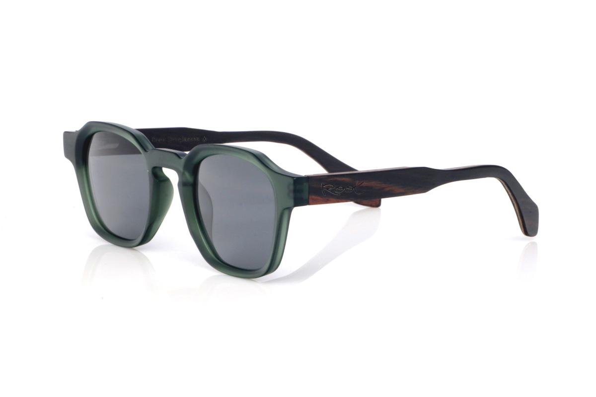Wood eyewear of Ebony JADE. The JADE wooden sunglasses combine a translucent deep-green front with a smooth satin finish and a rounded-oval silhouette with soft lines that feels balanced and easy to wear. The keyhole bridge adds a classic touch with personality, keeping the overall look clean and very contemporary.

Ebony temples add the elegant contrast of dark natural wood, with subtle grain that gives each pair its own unique nuances. A comfortable and versatile model for everyday wear, with full UV protection.

Dimensions: 144x46 mm
Lens width: 46
 for Wholesale & Retail | Root Sunglasses® 
