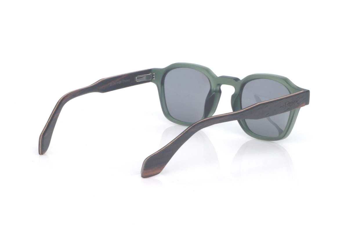 Wood eyewear of Ebony JADE. The JADE wooden sunglasses combine a translucent deep-green front with a smooth satin finish and a rounded-oval silhouette with soft lines that feels balanced and easy to wear. The keyhole bridge adds a classic touch with personality, keeping the overall look clean and very contemporary.

Ebony temples add the elegant contrast of dark natural wood, with subtle grain that gives each pair its own unique nuances. A comfortable and versatile model for everyday wear, with full UV protection.

Dimensions: 144x46 mm
Lens width: 46
 for Wholesale & Retail | Root Sunglasses® 