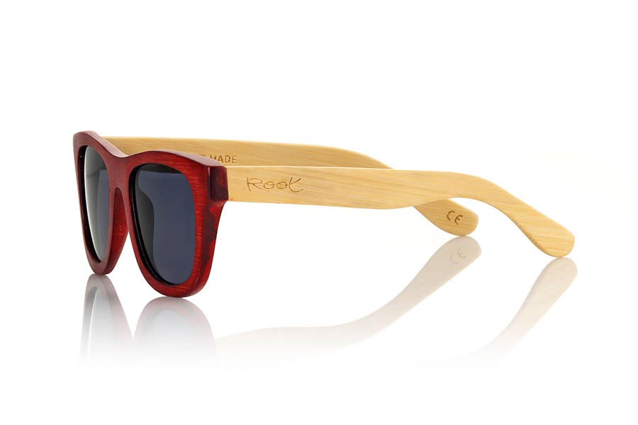 Wood eyewear of Bamboo VOLCANO. The Volcano sunglasses are made of Bamboo wood with the front in stained in red color and sideburns of natural bamboo. Front measssure: 147x50mm for Wholesale & Retail | Root Sunglasses® 