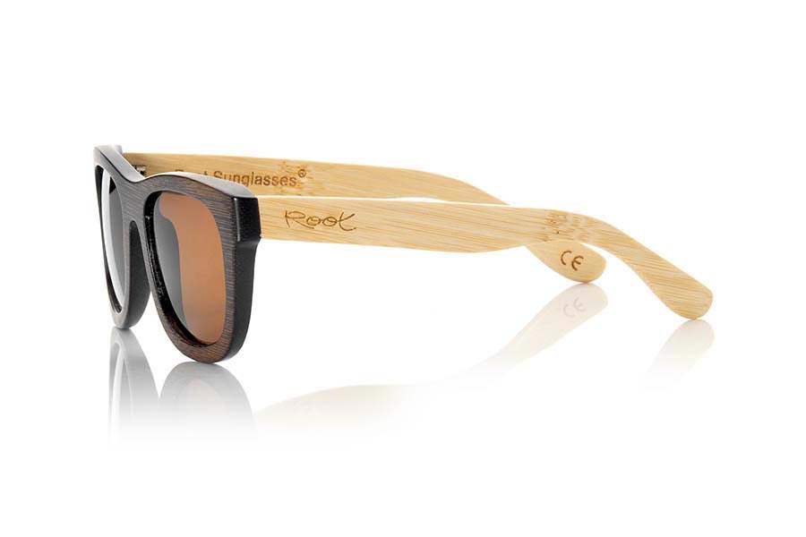 Wood eyewear of Bamboo WOODHEART. The sunglasses Woodheart are made of bamboo wood, with the front dyed  in brown tones and sideburns in natural bamboo color  where the wood grain is always present it is a classical frame standard size that feels good to both boys and girls.  Front measssure 147x50mm for Wholesale & Retail | Root Sunglasses® 