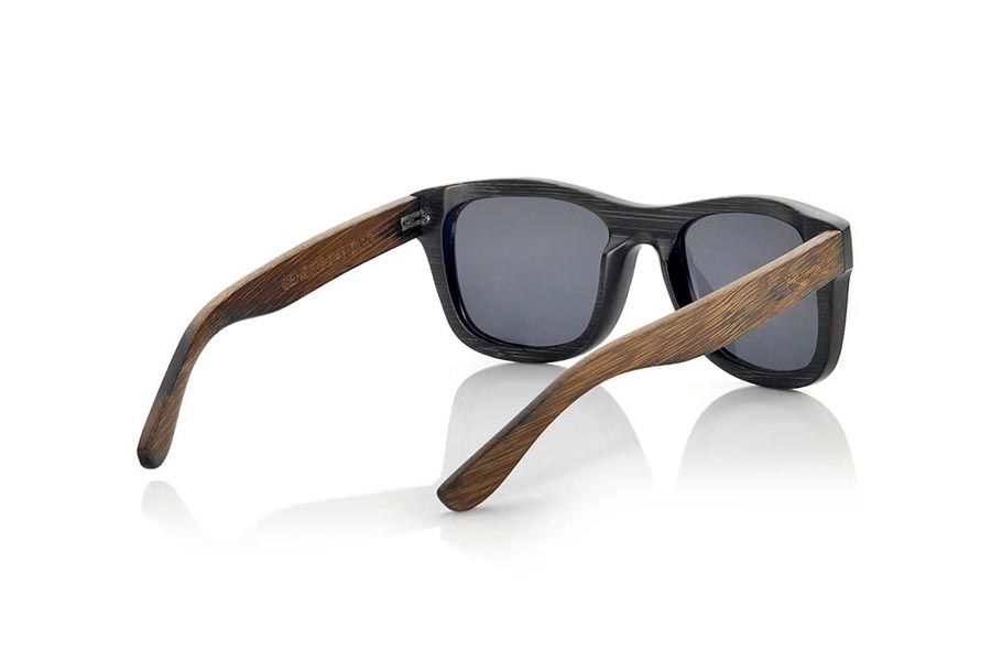 Wood eyewear of Bamboo GENESIS S. Genesis Wood Sunglasses are made in two-tone tinted bamboo with black front and dark brown sideburns.  is a classic frame with a small size for people who feel better glasses  Small, they are elegant and discreet, however they will not be able to stop looking at you. frontal measurement:  136x44mm for Wholesale & Retail | Root Sunglasses® 