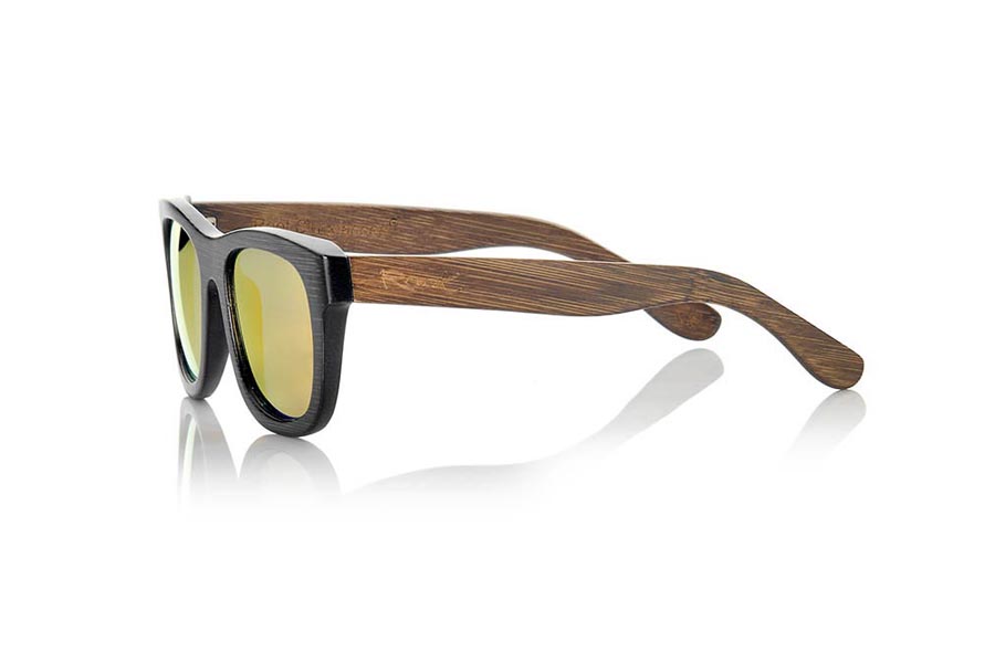 Wood eyewear of Bamboo GENESIS S. Genesis Wood Sunglasses are made in two-tone tinted bamboo with black front and dark brown sideburns.  is a classic frame with a small size for people who feel better glasses  Small, they are elegant and discreet, however they will not be able to stop looking at you. frontal measurement:  136x44mm for Wholesale & Retail | Root Sunglasses® 