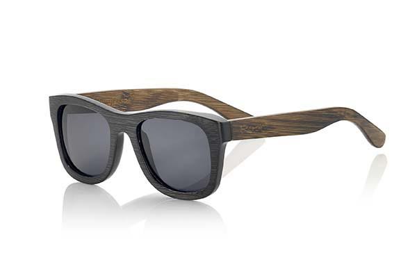 Wood eyewear of Bamboo GÉNESIS. The Genesis wooden Sunglasses are made of bamboo dyed with two-tone front in dark brown and brown sideburns clearer. Traditional forms of Genesis are a unisex, elegant and discrete model however can not stop looking. Available in two sizes, normal size is suitable for wider faces, round or if you like a little oversized models otherwise choose better a little smaller model. Various combinations of lenses. Front measssure  140x42mm for Wholesale & Retail | Root Sunglasses® 