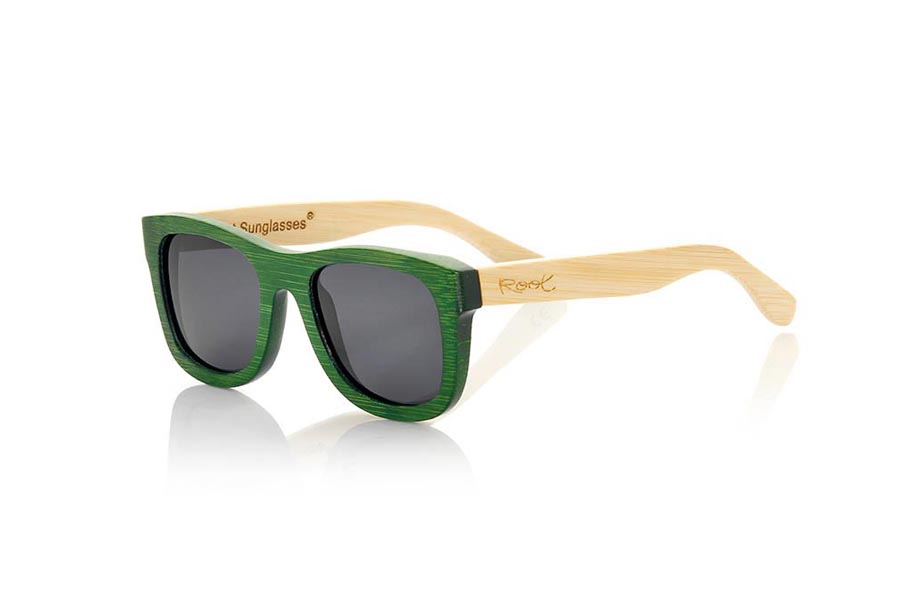 Wood eyewear of Bamboo AMAZONIAN S. The Amazonian sunglasses are made of bamboo wood combining the green tinted front with the natural bamboo sideburns, its a classic frame with a small size for people who feel better glasses  Small. The Amazonians are a green bet that keeps your eyes clean. Frontal Measurement: 136x44mm for Wholesale & Retail | Root Sunglasses® 