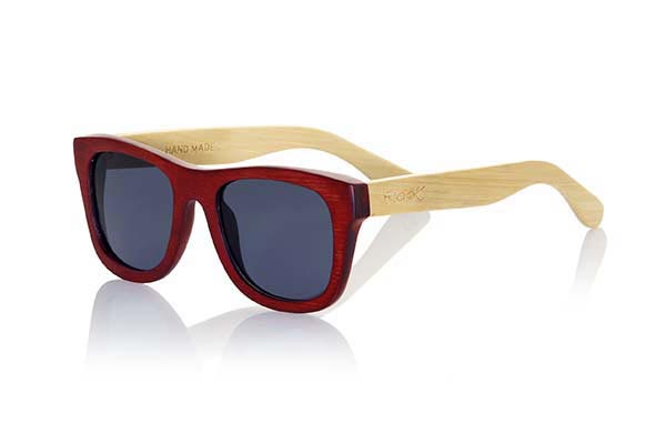 Wood eyewear of Bamboo VOLCANO. The Volcano sunglasses are made of Bamboo wood with the front in stained in red color and sideburns of natural bamboo. Front measssure: 147x50mm for Wholesale & Retail | Root Sunglasses® 