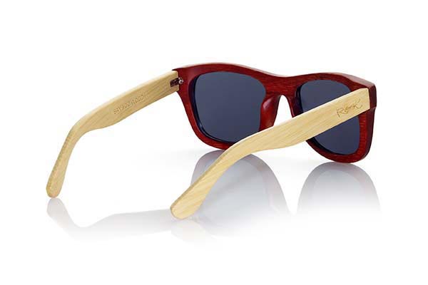 Wood eyewear of Bamboo VOLCANO. The Volcano sunglasses are made of Bamboo wood with the front in stained in red color and sideburns of natural bamboo. Front measssure: 147x50mm for Wholesale & Retail | Root Sunglasses® 