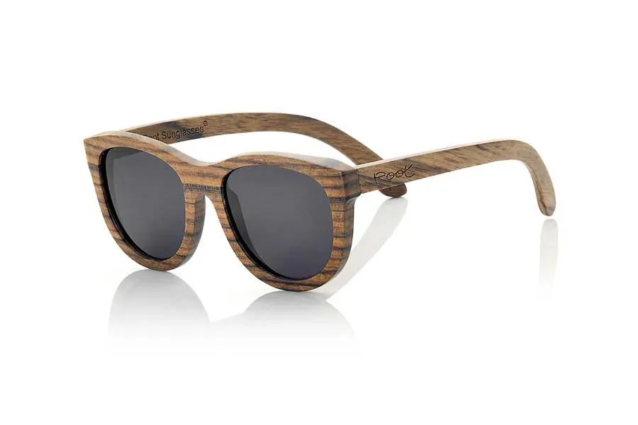 Wood eyewear of Zebrano KALETA. Kaleta sunglasses are made of wood Zebra. This wood has a color and a marked countersunk dark streak, rounded shapes sit well with all types of people and faces, Kaleta are one of the most popular models of our catalog for its elegance and simplicity. Front Measure: 141x52mm for Wholesale & Retail | Root Sunglasses® 