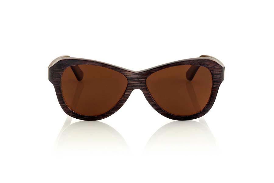 Wood eyewear of Bamboo REVENGE. Revenge sunglasses are made of bamboo wood stained in brown tones that leave visible wood grain. It is oriented to a female pubic suggestive lines with rounded edges standard size will be amazed by its lightness and comfort model. Front Measure: 147x48mm for Wholesale & Retail | Root Sunglasses® 