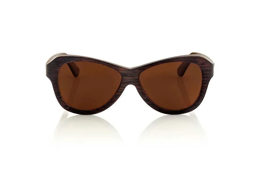 Wood eyewear of Bamboo REVENGE. Revenge sunglasses are made of bamboo wood stained in brown tones that leave visible wood grain. It is oriented to a female pubic suggestive lines with rounded edges standard size will be amazed by its lightness and comfort model. Front Measure: 147x48mm for Wholesale & Retail | Root Sunglasses® 