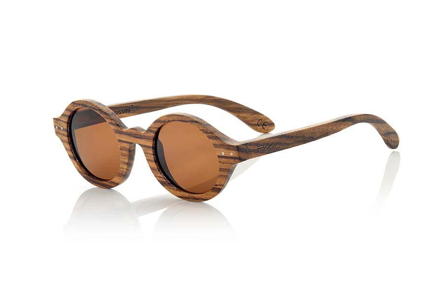 Wood eyewear of Zebrano BOHO ECO. The Boho Eco sun glasses are made of Zebrano wood combined with gray or brown lenses. It is a round pattern with peaks at the sides and metal ornaments at the ends made with a beautiful wood that adds an elegant at  bohemian look to your point of view. Measurements: 147x48mm for Wholesale & Retail | Root Sunglasses® 