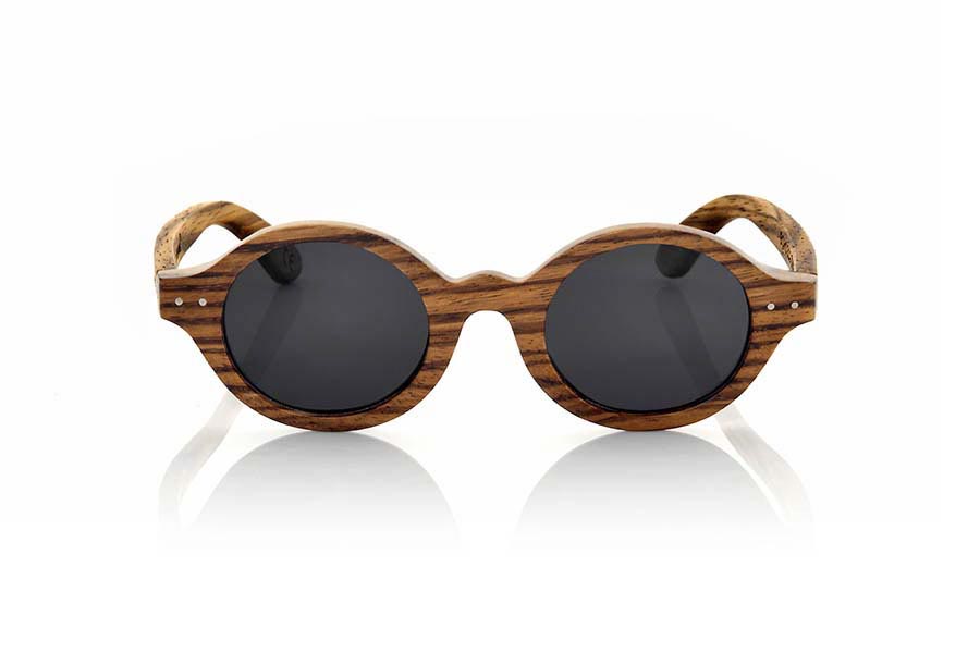 Wood eyewear of Zebrano BOHO ECO. The Boho Eco sun glasses are made of Zebrano wood combined with gray or brown lenses. It is a round pattern with peaks at the sides and metal ornaments at the ends made with a beautiful wood that adds an elegant at  bohemian look to your point of view. Measurements: 147x48mm for Wholesale & Retail | Root Sunglasses® 