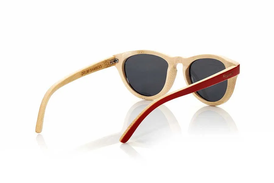 Wood eyewear of Bamboo DRUM. The Drum sunglasses are made of natural bamboo wood  with the front in solid black and the edges and interior in natural bamboo combined with gray lenses, it is a model rounded somewhat smaller than other models suitable Root especially for girls. Front Size: 135x43mm for Wholesale & Retail | Root Sunglasses® 