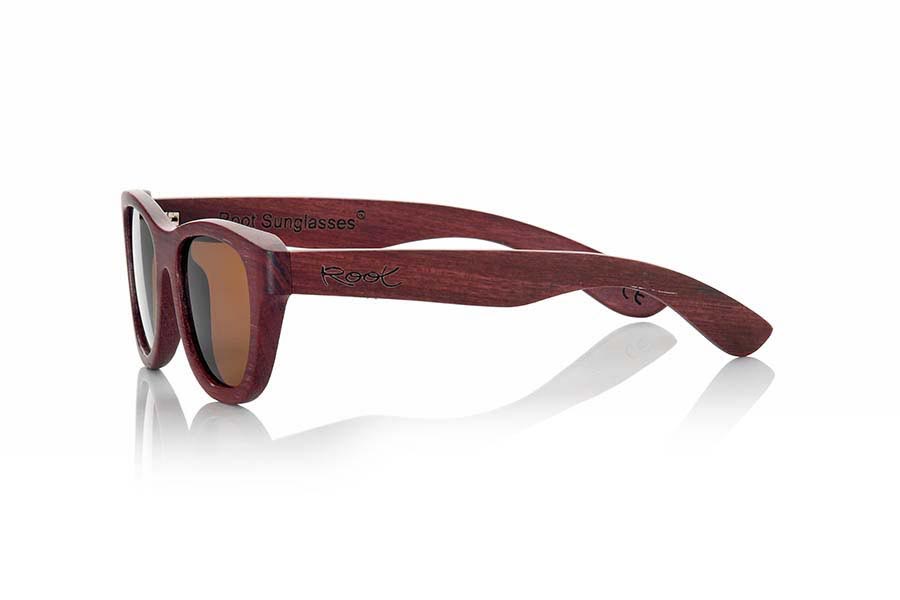 Wood eyewear of Padauk RAPSODIA. Rhapsody sunglasses are made of Padauk wood. This spectacular natural purple tones model has been combined with Grey lenses, is of a small size and are designed especially for girls. Front Size: 135x43mm for Wholesale & Retail | Root Sunglasses® 