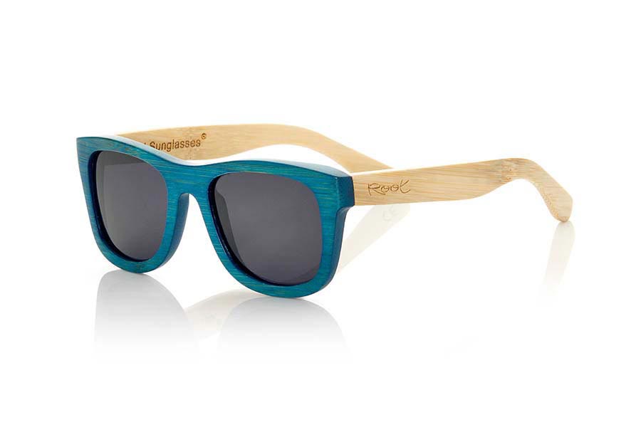 Wood eyewear of Bamboo TROPICBLUE. TropicBlue sunglasses are made of bamboo wood with the front in blue and sideburns in natural bamboo combined with blue mirror lenses. It is a classic frame that adapts well to all kinds of faces for them and for them with which you will not go unnoticed.  Front measssure: 147x50mm for Wholesale & Retail | Root Sunglasses® 