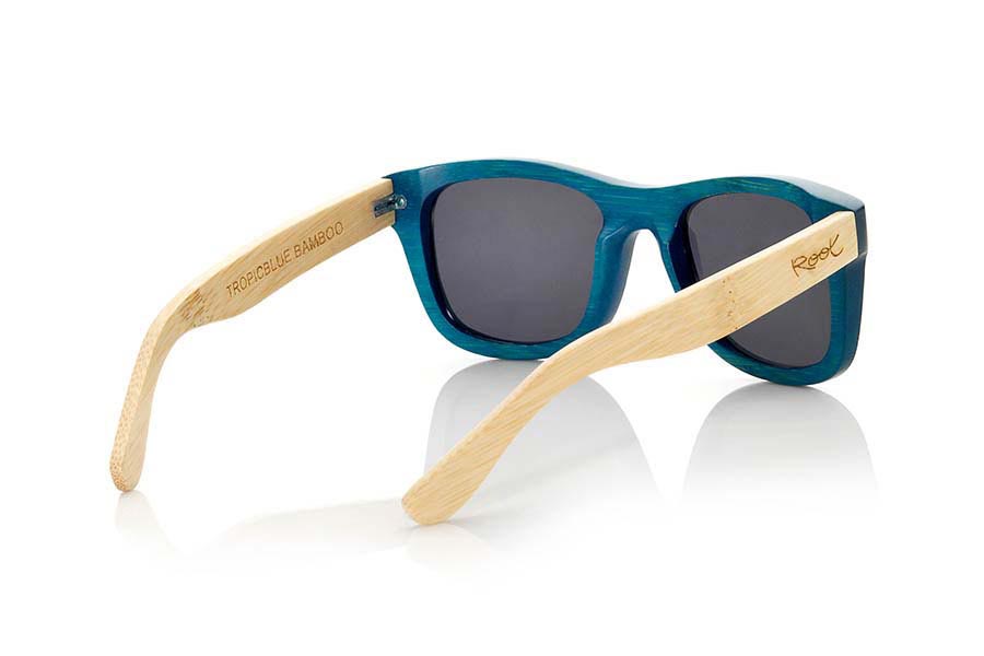 Wood eyewear of Bamboo TROPICBLUE. TropicBlue sunglasses are made of bamboo wood with the front in blue and sideburns in natural bamboo combined with blue mirror lenses. It is a classic frame that adapts well to all kinds of faces for them and for them with which you will not go unnoticed.  Front measssure: 147x50mm for Wholesale & Retail | Root Sunglasses® 