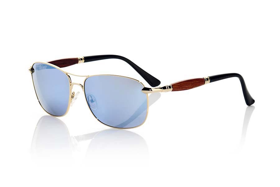 Wood eyewear of Rosewood modelo ATLAS. ATLAS sunglasses of the MIXED PREMIUM series are manufactured with the front panel color gold negroo quality metal rod and pins in natural rosewood combined with rod can be adjusted if necessary. It's a high quality of the popular series combined Aviator version with gray gradient lenses or blue REVO. The quality of the materials and their perfect completion will surprise you. Front size: 147x47mm | Root Sunglasses®