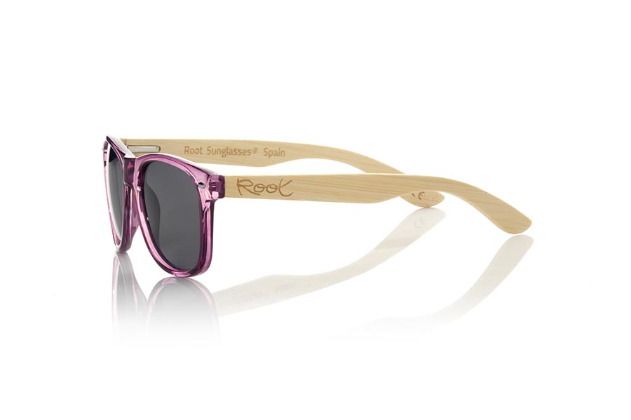 Wood eyewear of  CANDY PUR. The Candy Pur sunglasses are made with the front in transparent glossy clear purple synthetic material and natural bamboo wood sideburns combined with four colors of lenses that will allow you to adapt them to your style. Frontal measurement: 148x50mm for Wholesale & Retail | Root Sunglasses® 