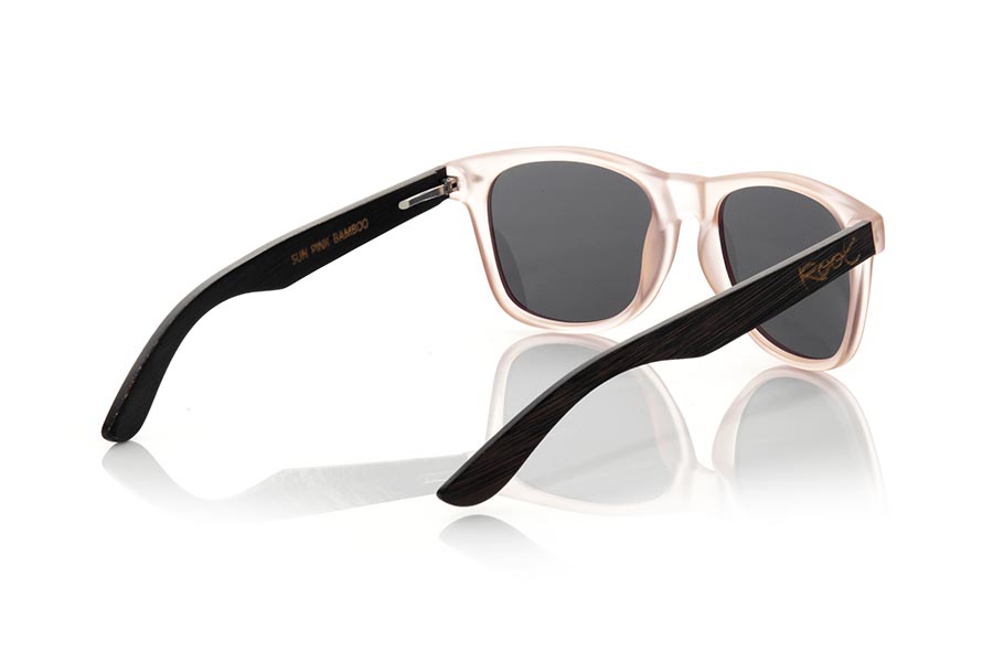 Wood eyewear of Bamboo SUN PINK MX. The Sun pink sunglasses are made with the front in matte transparent light pink synthetic material and the black dyed natural bamboo wood sideburns combined with three colors of lenses that suit your style. Frontal measurement: 148x50mm for Wholesale & Retail | Root Sunglasses® 