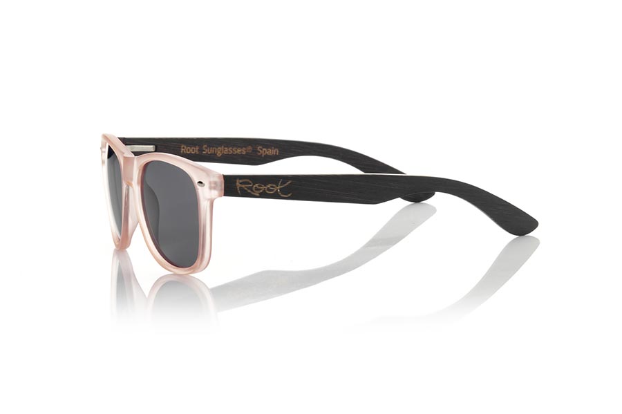 Wood eyewear of Bamboo SUN PINK MX. The Sun pink sunglasses are made with the front in matte transparent light pink synthetic material and the black dyed natural bamboo wood sideburns combined with three colors of lenses that suit your style. Frontal measurement: 148x50mm for Wholesale & Retail | Root Sunglasses® 