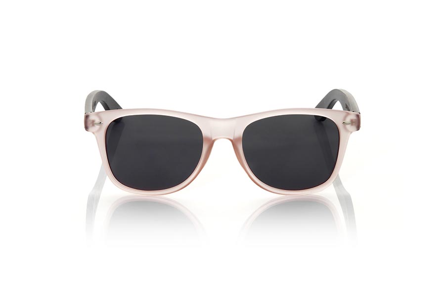 Wood eyewear of Bamboo SUN PINK MX. The Sun pink sunglasses are made with the front in matte transparent light pink synthetic material and the black dyed natural bamboo wood sideburns combined with three colors of lenses that suit your style. Frontal measurement: 148x50mm for Wholesale & Retail | Root Sunglasses® 