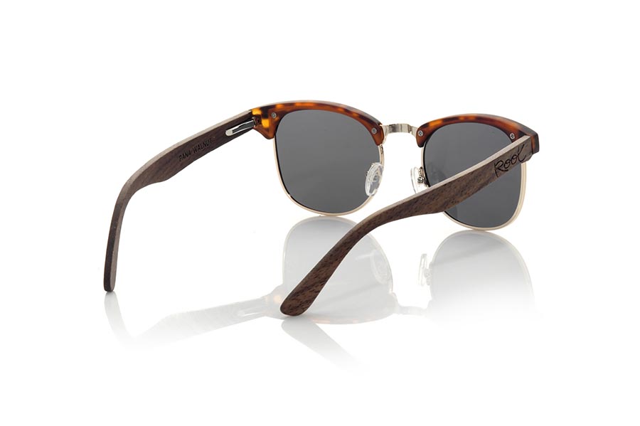 Wood eyewear of Walnut PANA. PANA sunglasses are made with the front in PC Matt CAREY combined with golden metal and the sideburns in natural walnut wood, combined with various colors of lenses are adapted to your style. Frontal measurement: 140x45mm for Wholesale & Retail | Root Sunglasses® 