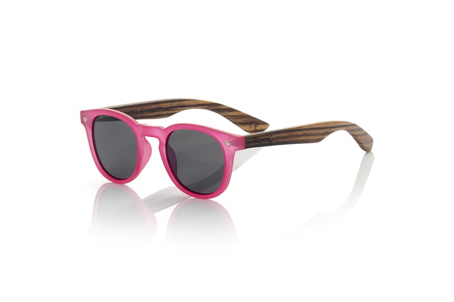 Wood eyewear of Zebrano KID R PINK. The Kid R Pink Children's sunglasses are made with the pink PC frame and natural zebra wood sideburns available in various lens combinations that suit the tastes of children and their daddies. Frontal measurement: 125x41mm for Wholesale & Retail | Root Sunglasses® 