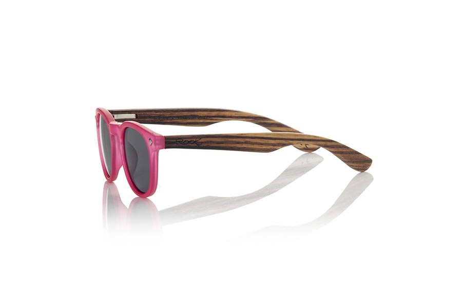 Wood eyewear of Zebrano KID R PINK. The Kid R Pink Children's sunglasses are made with the pink PC frame and natural zebra wood sideburns available in various lens combinations that suit the tastes of children and their daddies. Frontal measurement: 125x41mm for Wholesale & Retail | Root Sunglasses® 