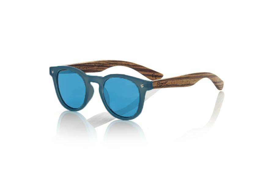 Wood eyewear of Zebrano KID R BLUE. The Kid R BLUE Children's sunglasses are made with the BLUE PC frame and natural zebra wood sideburns available in various lens combinations that suit the tastes of children and their daddies. Frontal measurement: 125x41mm for Wholesale & Retail | Root Sunglasses® 