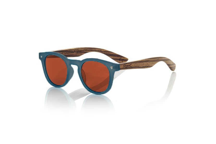 Wood eyewear of Zebrano KID R BLUE. The Kid R BLUE Children's sunglasses are made with the BLUE PC frame and natural zebra wood sideburns available in various lens combinations that suit the tastes of children and their daddies. Frontal measurement: 125x41mm for Wholesale & Retail | Root Sunglasses® 