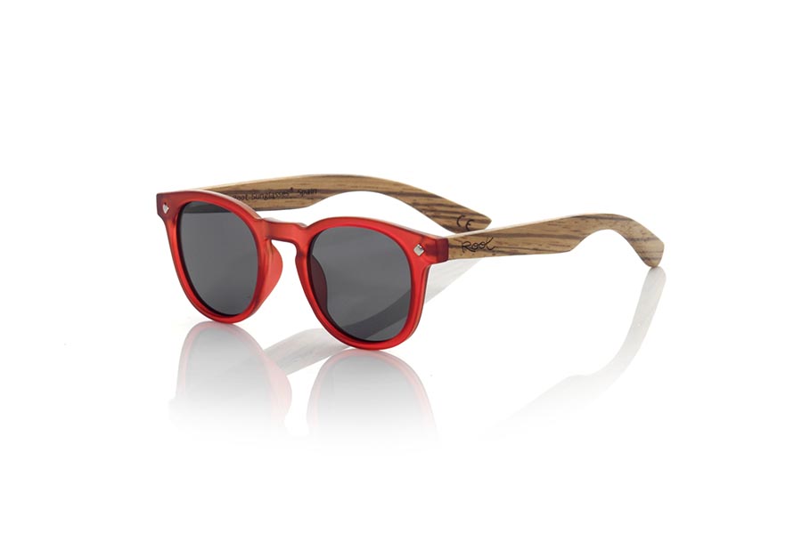 Wood eyewear of Zebrano KID R RED. The Kid R Red Children's sunglasses are made with the Red PC frame and natural zebra wood sideburns available in various lens combinations that suit the tastes of children and their daddies. Frontal measurement: 125x41mm for Wholesale & Retail | Root Sunglasses® 