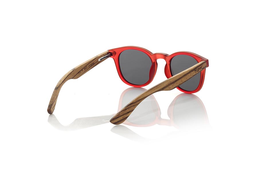 Wood eyewear of Zebrano KID R RED. The Kid R Red Children's sunglasses are made with the Red PC frame and natural zebra wood sideburns available in various lens combinations that suit the tastes of children and their daddies. Frontal measurement: 125x41mm for Wholesale & Retail | Root Sunglasses® 