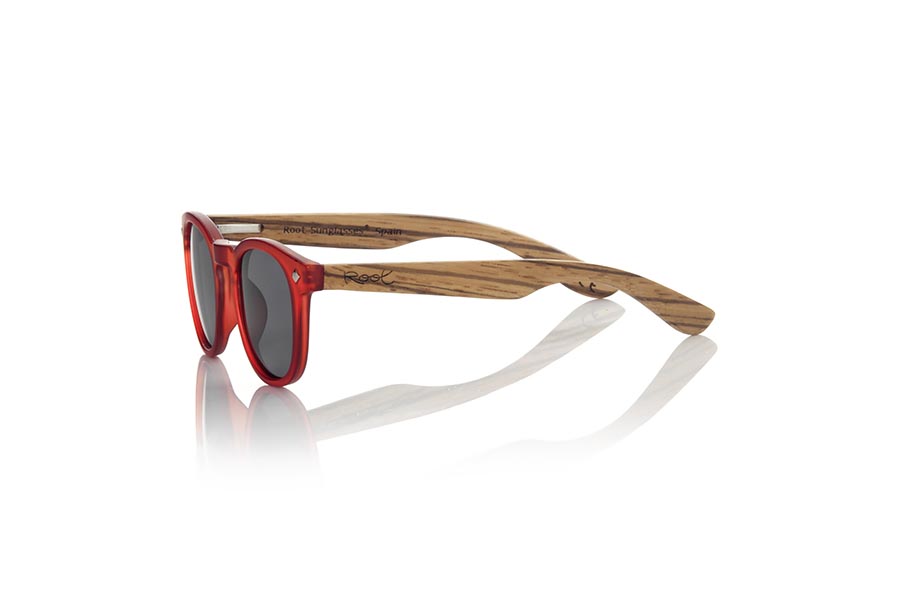 Wood eyewear of Zebrano KID R RED. The Kid R Red Children's sunglasses are made with the Red PC frame and natural zebra wood sideburns available in various lens combinations that suit the tastes of children and their daddies. Frontal measurement: 125x41mm for Wholesale & Retail | Root Sunglasses® 