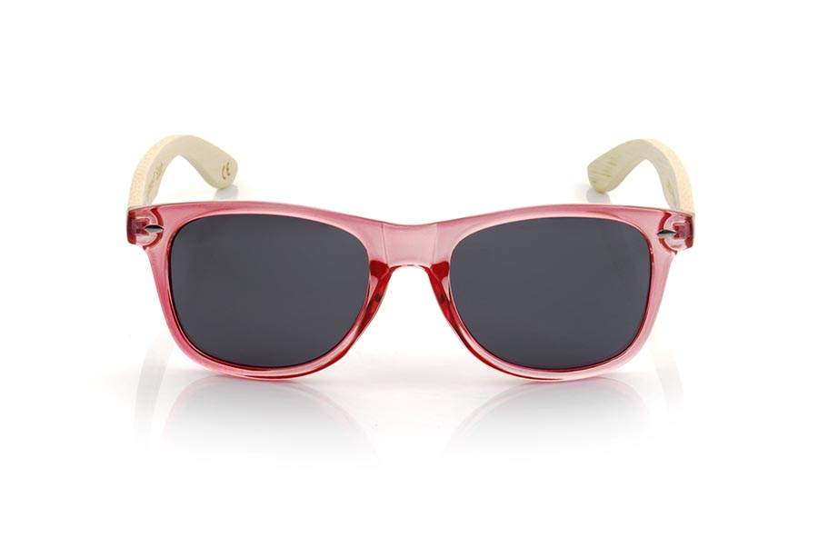 Gafas de Madera Natural de Bambú CANDY PINK DS. Las gafas de sol Candy Pink están fabricadas con el frontal en material sintético Rosado claro transparente brillo y las varillas de madera de bambú natural combinadas con cuatro colores de lentes que te permitirán adaptarlas a tu estilo. Medida frontal: 148x50mm Venta al Por Mayor y Detalle | Root Sunglasses® 