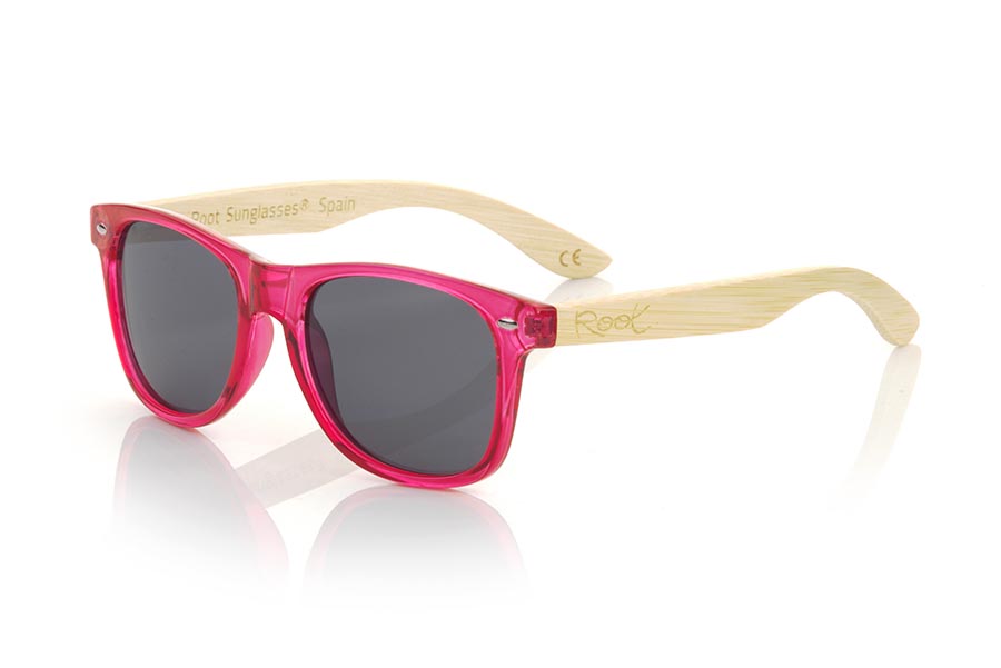 Wood eyewear of Bamboo CANDY RED DS. The Candy RED sunglasses are made with the front in transparent glossy clear red  synthetic material and natural bamboo wood sideburns combined with four colors of lenses that will allow you to adapt them to your style. Frontal measurement: 148x50mm for Wholesale & Retail | Root Sunglasses® 