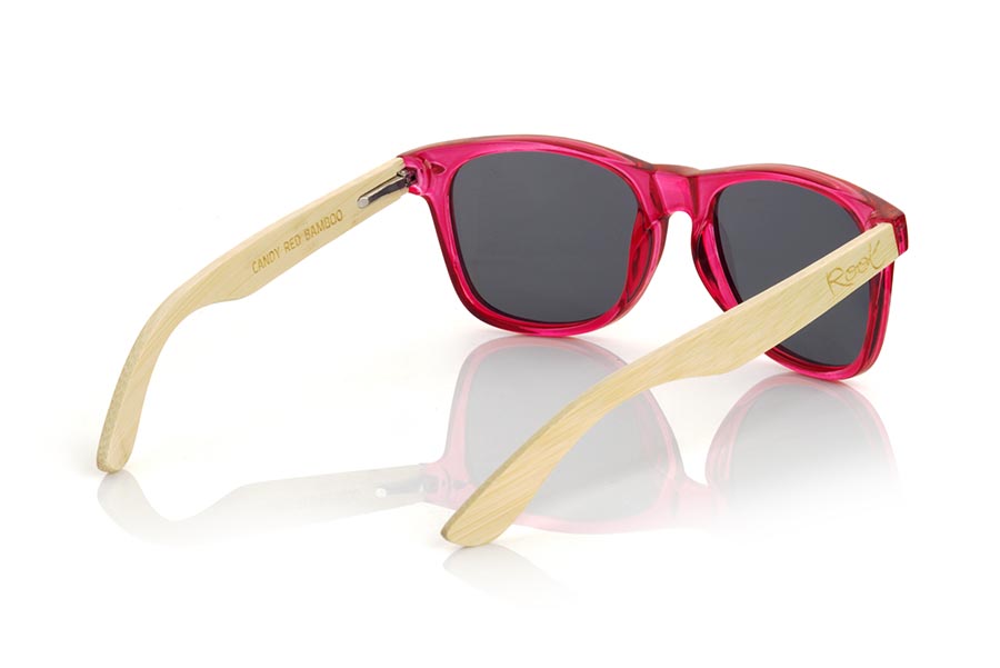 Wood eyewear of Bamboo CANDY RED DS. The Candy RED sunglasses are made with the front in transparent glossy clear red  synthetic material and natural bamboo wood sideburns combined with four colors of lenses that will allow you to adapt them to your style. Frontal measurement: 148x50mm for Wholesale & Retail | Root Sunglasses® 