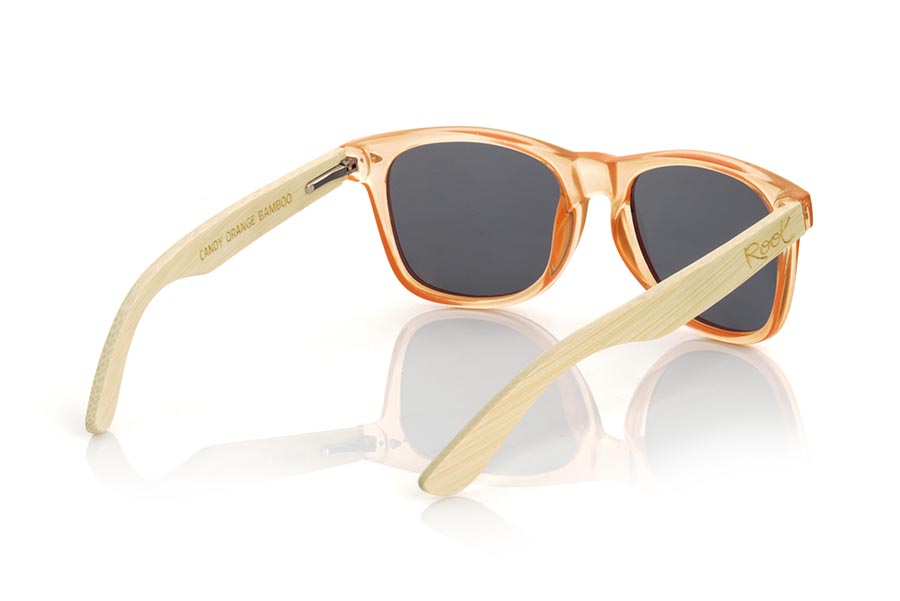 Wood eyewear of Bamboo CANDY ORANGE DS. The Candy ORANGE DS sunglasses are made with the front in transparent glossy clear Orange synthetic material and natural bamboo wood sideburns combined with four colors of lenses that will allow you to adapt them to your style. Frontal measurement: 148x50mm for Wholesale & Retail | Root Sunglasses® 