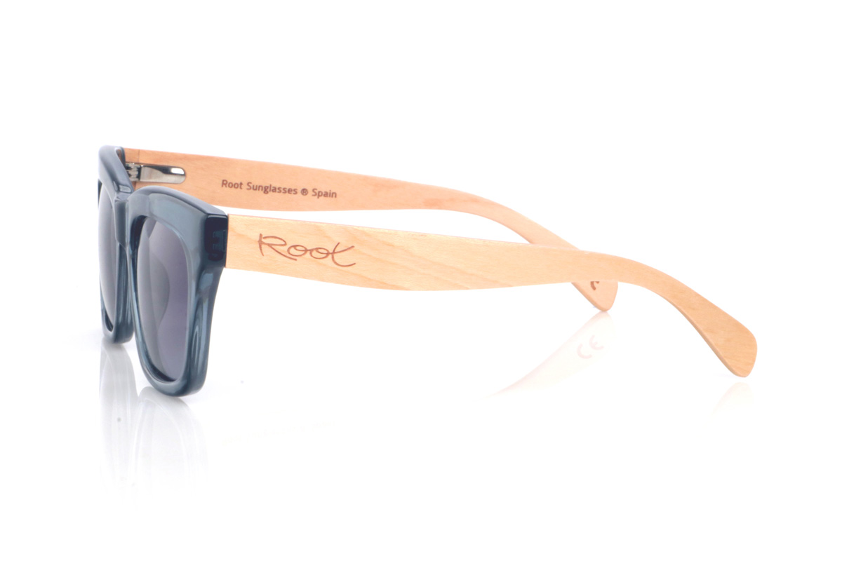 Wood eyewear of Maple MERYL DS. The MERYL wooden sunglasses stand out for their translucent blue-grey front, with an oversized square silhouette and a subtle cat-eye touch that feels flattering and full of presence. The shape is clean and modern, with a balanced thickness that frames the lenses nicely without looking heavy.

The soft gradient lenses complete the look, while the maple wood temples add a natural, light contrast and a comfortable feel for everyday wear.

Dimensions: 145x50 mm
Calibre: 51
 for Wholesale & Retail | Root Sunglasses® 