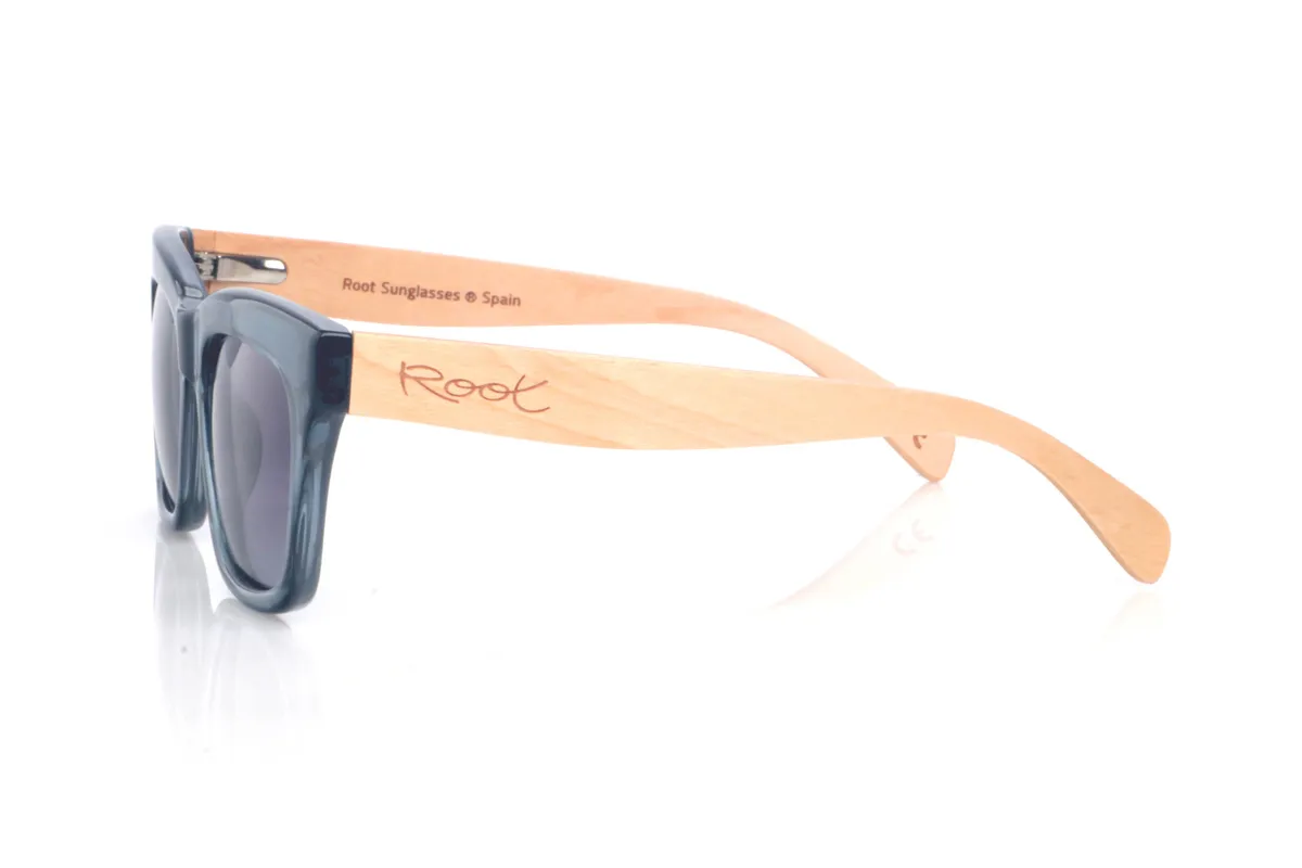 Wood eyewear of Maple MERYL DS. The MERYL wooden sunglasses stand out for their translucent blue-grey front, with an oversized square silhouette and a subtle cat-eye touch that feels flattering and full of presence. The shape is clean and modern, with a balanced thickness that frames the lenses nicely without looking heavy.

The soft gradient lenses complete the look, while the maple wood temples add a natural, light contrast and a comfortable feel for everyday wear.

Dimensions: 145x50 mm
Calibre: 51
 for Wholesale & Retail | Root Sunglasses® 