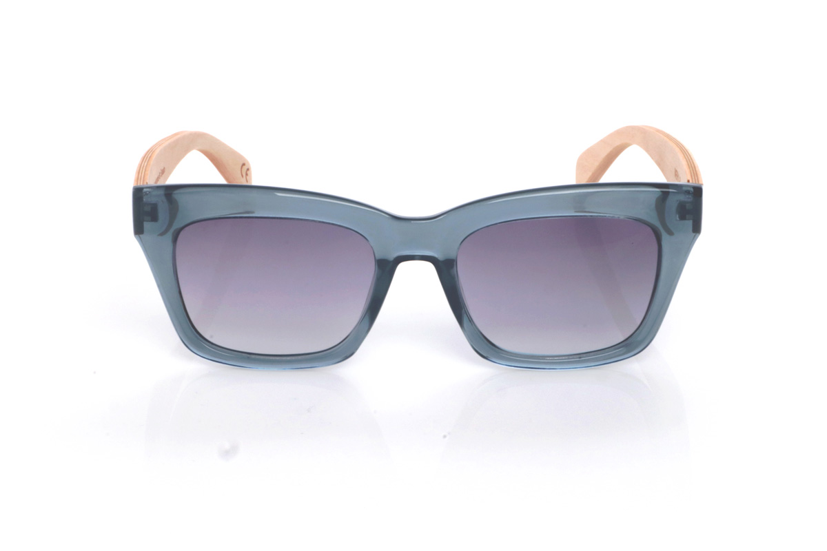 Wood eyewear of Maple MERYL DS. The MERYL wooden sunglasses stand out for their translucent blue-grey front, with an oversized square silhouette and a subtle cat-eye touch that feels flattering and full of presence. The shape is clean and modern, with a balanced thickness that frames the lenses nicely without looking heavy.

The soft gradient lenses complete the look, while the maple wood temples add a natural, light contrast and a comfortable feel for everyday wear.

Dimensions: 145x50 mm
Calibre: 51
 for Wholesale & Retail | Root Sunglasses® 