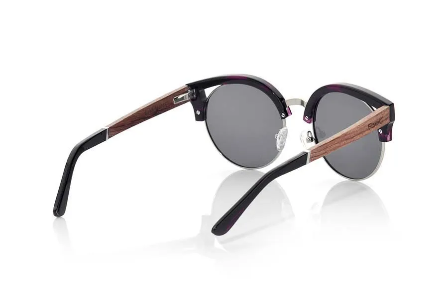 Wood eyewear of Rosewood ARYA. ARYA sunglasses of the MIXED PREMIUM series are manufactured with the front in acetate high-quality color purple and sideburns in natural ROSEWOOD finished in Rod covered in black acetate that can be adjusted if necessary. It's a model with eyebrow stylish acetate which sit perfectly to them. The quality of the materials and their perfect completion will surprise you. Front size: 140x54mm for Wholesale & Retail | Root Sunglasses® 