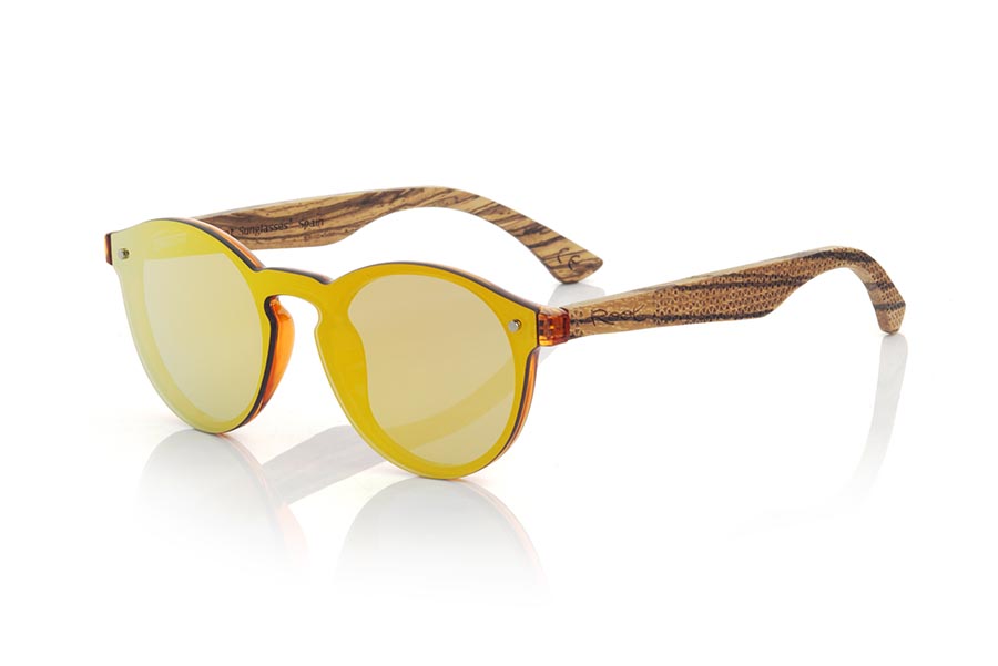 Wood eyewear of  SUN ORANGE. SUN ORANGE sunglasses are made with transparent orange synthetic material front and sideburns in zebra wood engraved with an ethnic pattern, it's a female model rounded very current trend <b>PC not POLARIZED</b>flat lenses cover around the front. Front size: 136X49mm for Wholesale & Retail | Root Sunglasses® 