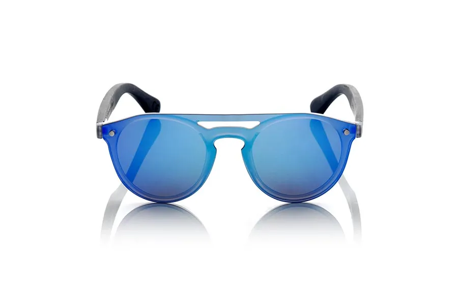 Wood eyewear of Ebony SAMBA NAVY. The SAMBA NAVY sunglasses are made with the frontal of translucent synthetic material and the sideburns in EBONY wood engraved with an ethnic pattern, this is a very rounded female model of current trend the flat lenses <b> non-polarized PC </b> Cover the whole frontal.. Frontal measurement: 137X49mm for Wholesale & Retail | Root Sunglasses® 