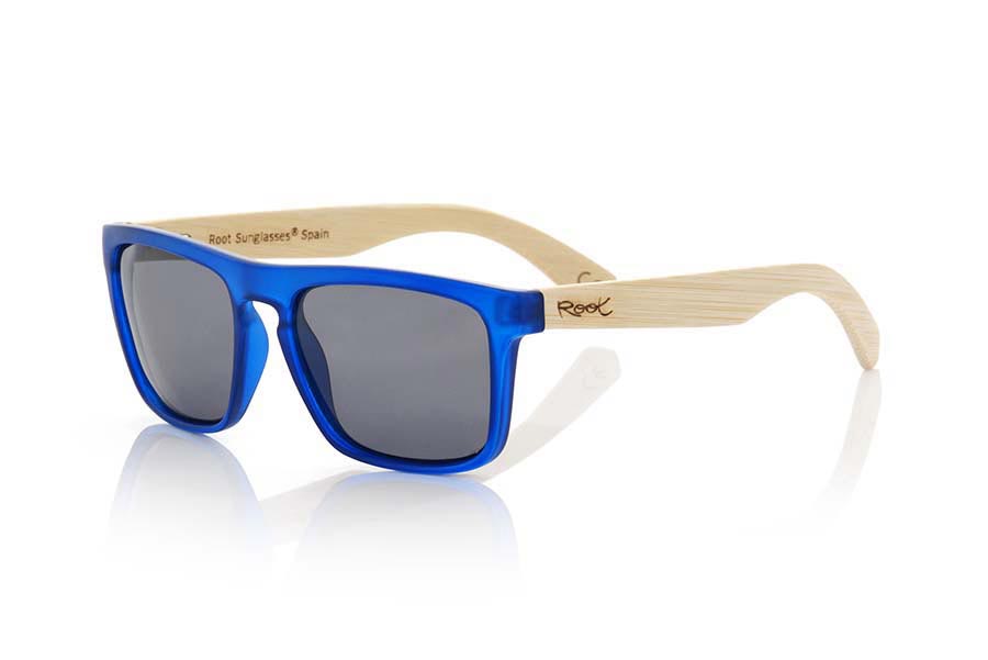 Wood eyewear of Bamboo WAVE BLUE. WAVE BLUE sunglasses are made with the front of transparent matte blue synthetic material and sideburns in bamboo, it's a very male angled square model with a look at the famous okley combined with four colors of lenses that will adapt perfectly to your taste and to your modern style. Front size: 145X50mm for Wholesale & Retail | Root Sunglasses® 