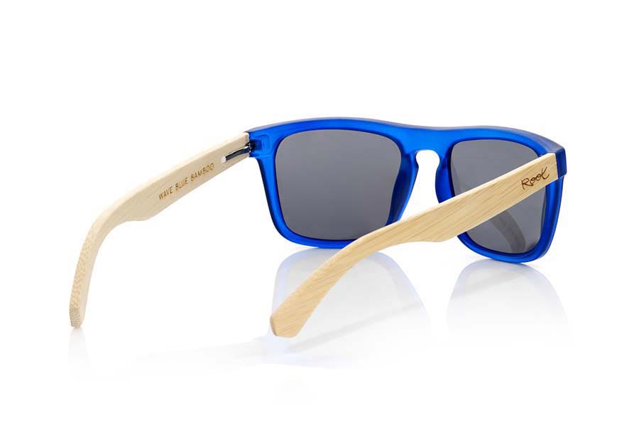 Wood eyewear of Bamboo WAVE BLUE. WAVE BLUE sunglasses are made with the front of transparent matte blue synthetic material and sideburns in bamboo, it's a very male angled square model with a look at the famous okley combined with four colors of lenses that will adapt perfectly to your taste and to your modern style. Front size: 145X50mm for Wholesale & Retail | Root Sunglasses® 